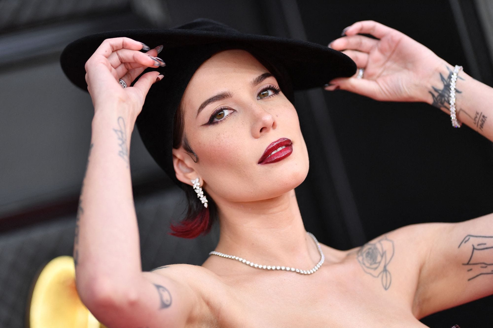 Halsey says she felt 'so connected' to her Disney World waiter before learning he had 2 tattoos inspired by her music